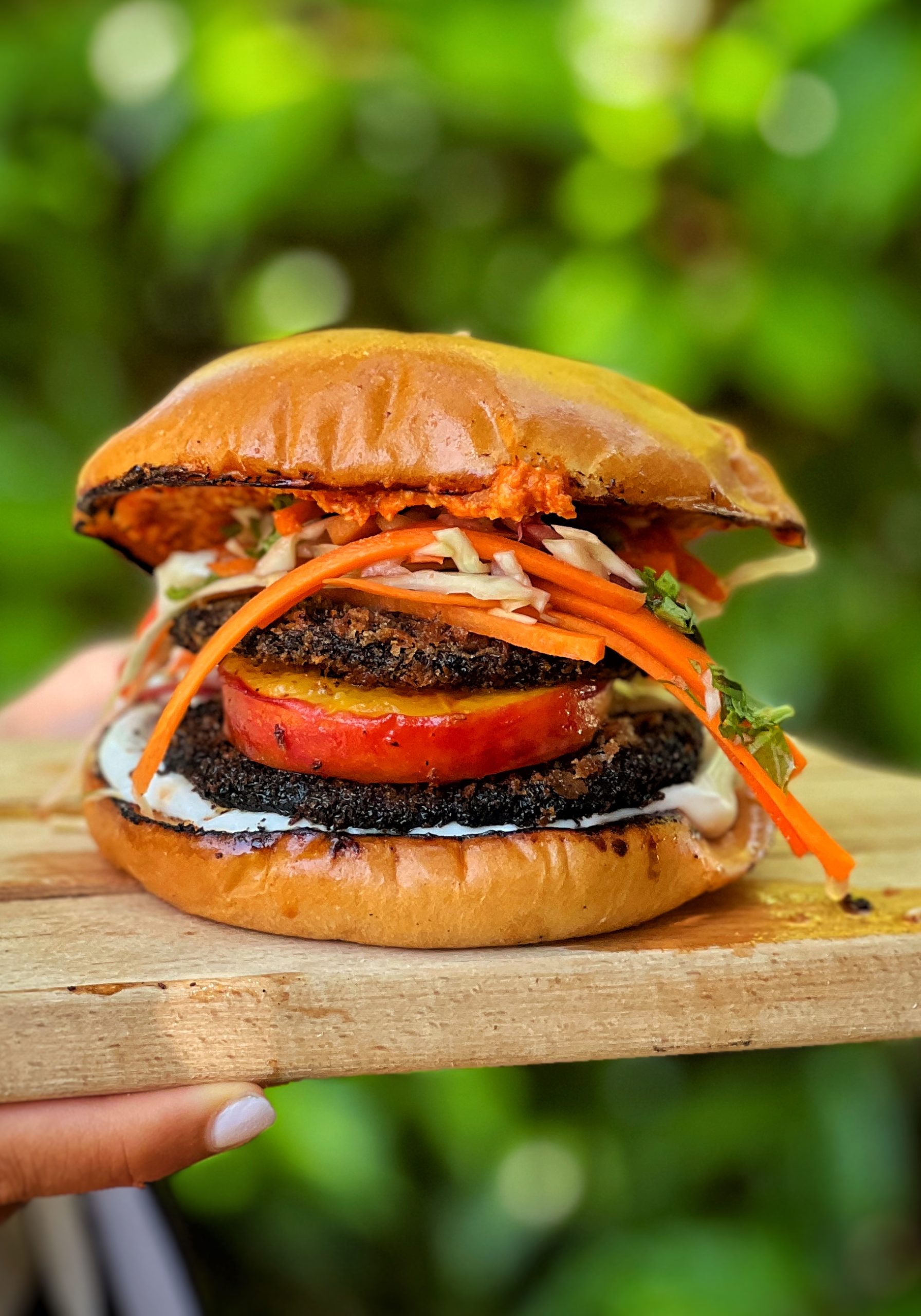 An image of Jerk mushroom, charred Peach & Caribbean Picklese burger