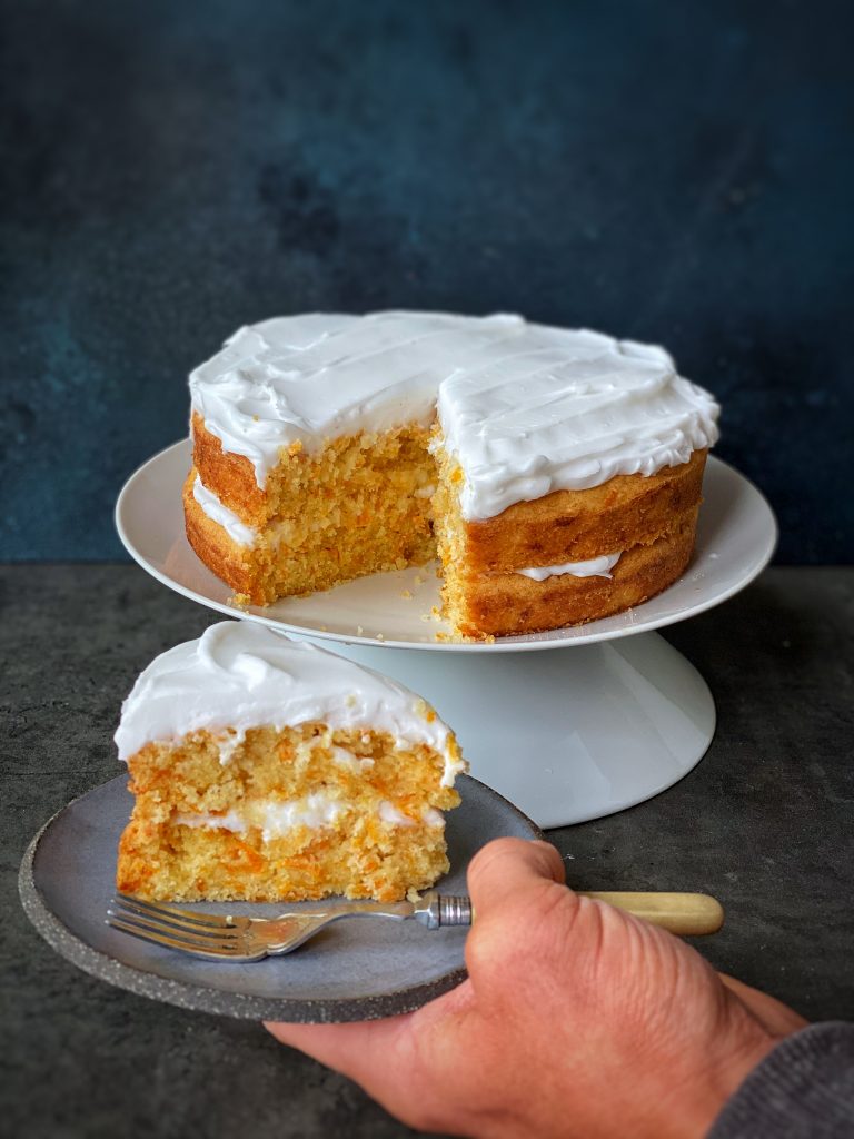 carrot cake being sliced