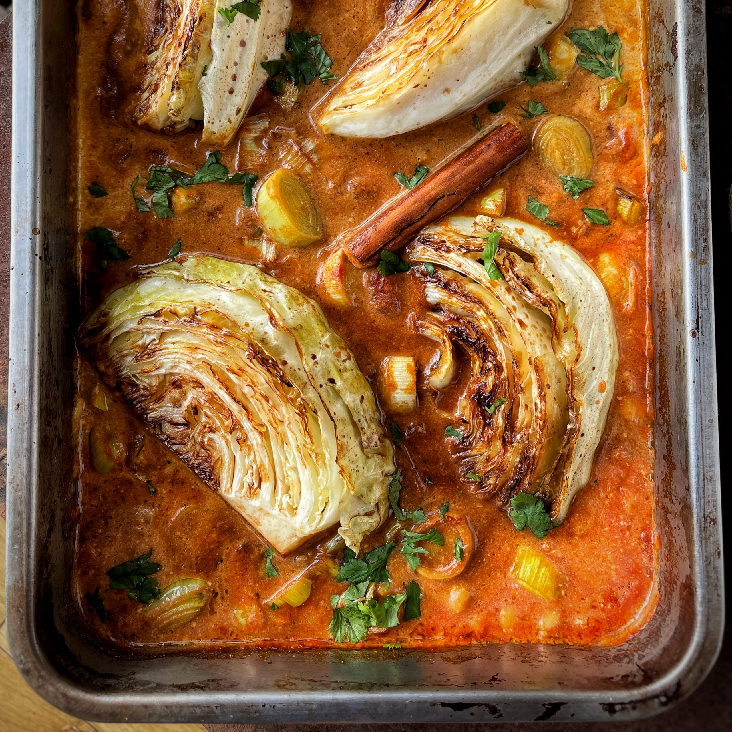 An image of charred crispy cabbage and chickpea stew