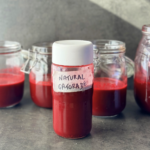 a photo of a glass bottle of red beet juice with label reading natural gatorade