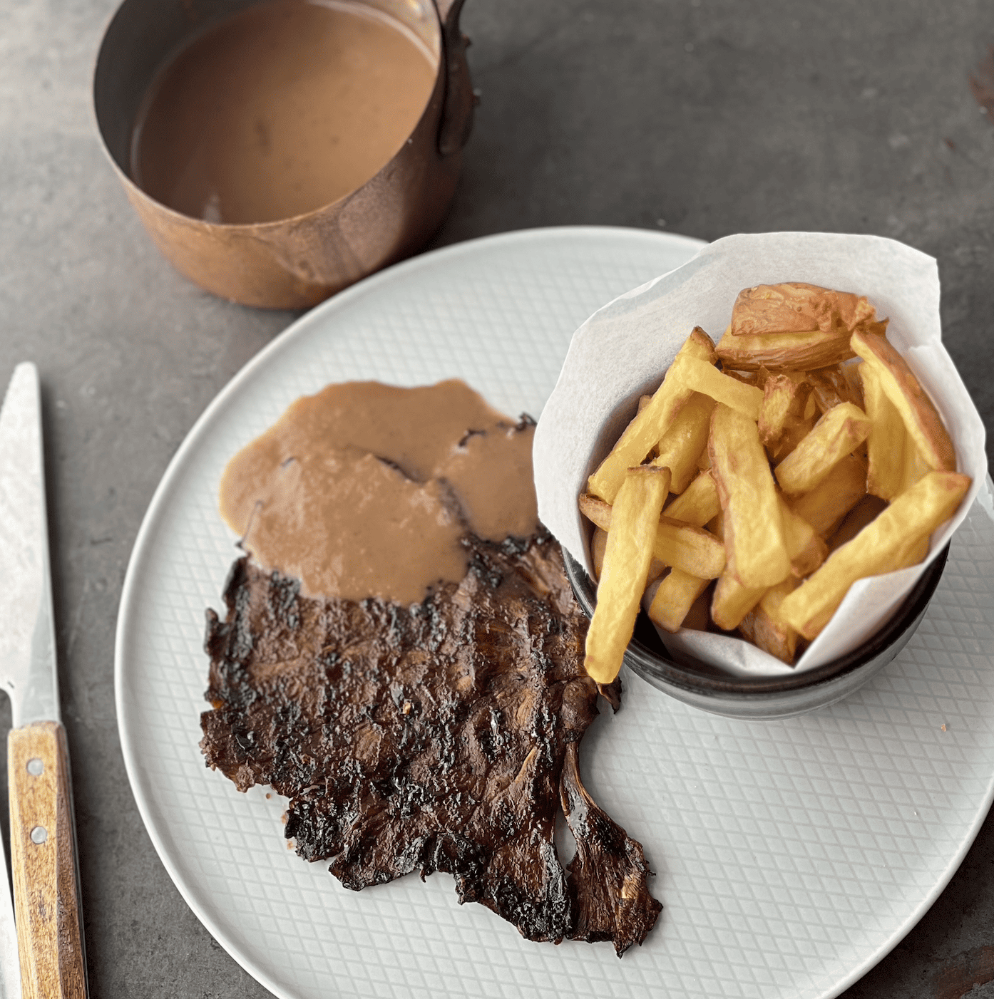 An image of Mushroom Steak with Pepper Sauce and Chips