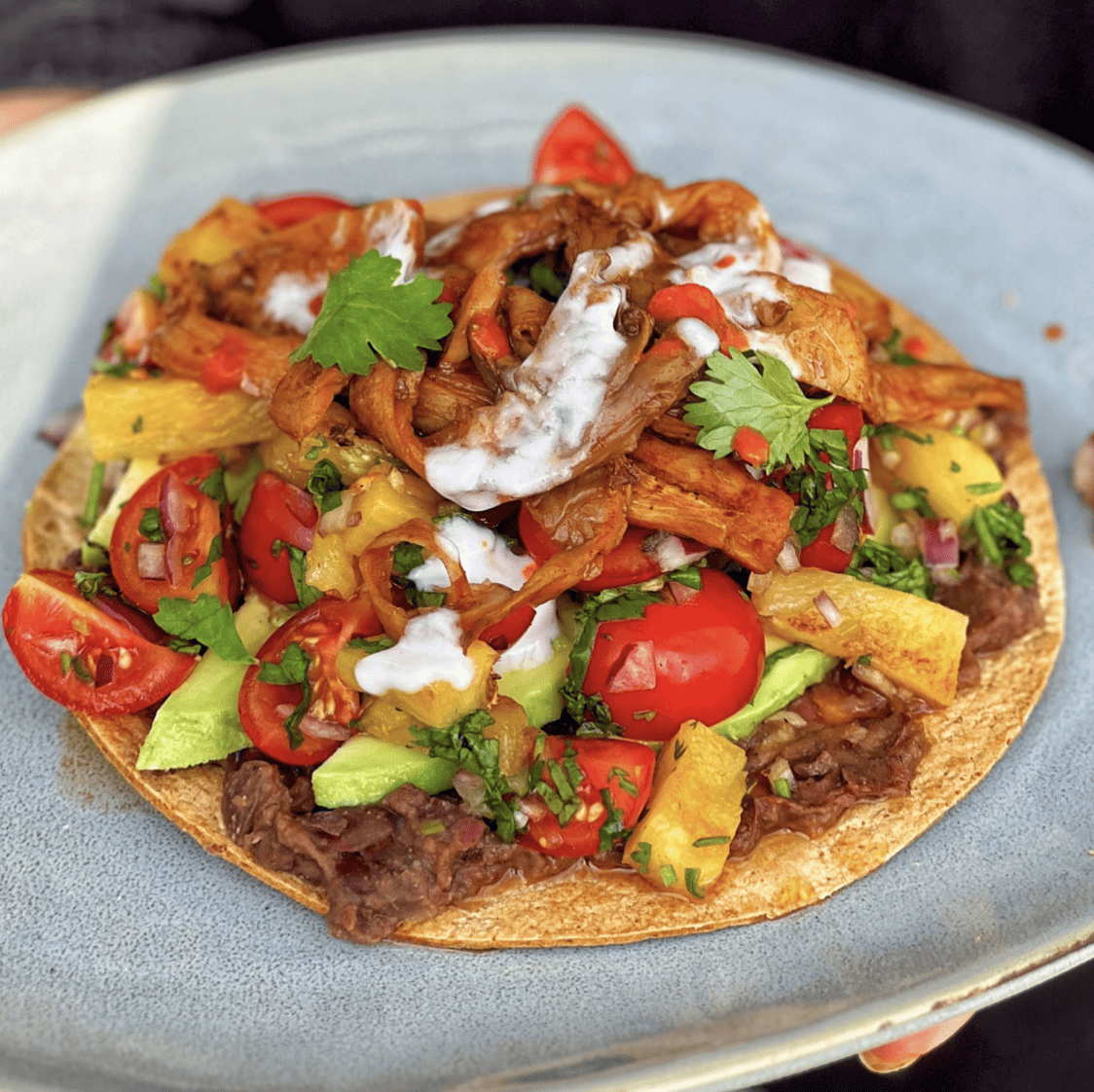 An image of Tostadas with Smoky Mushrooms and Charred Pineapple salsa