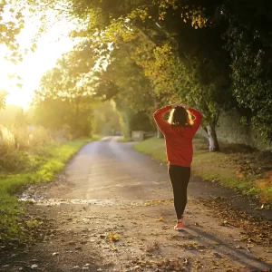 An image of a woman walking on a pathway